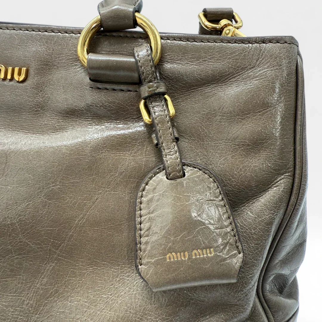 Miu Miu Vitello Shine handbag with shoulder strap in grey leather