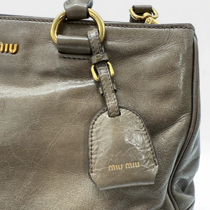 Miu Miu Vitello Shine handbag with shoulder strap in grey leather