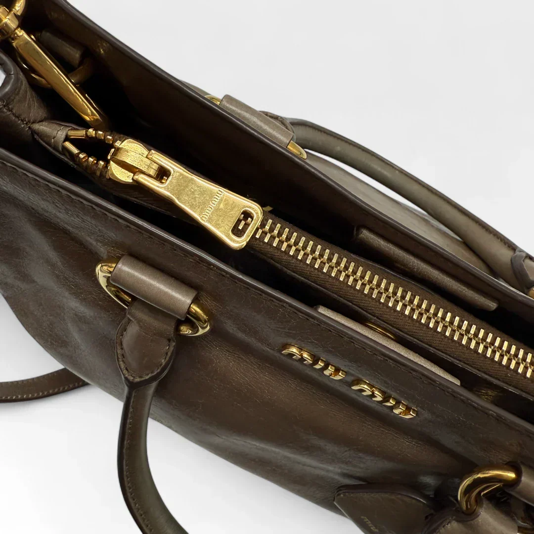 Miu Miu Vitello Shine handbag with shoulder strap in grey leather