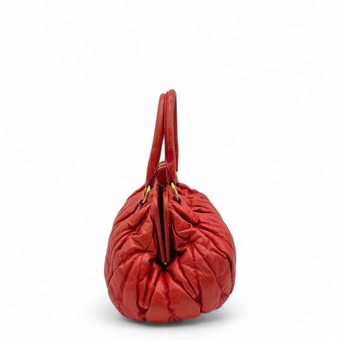 Miu Miu handbag made of leather matelasse dark red