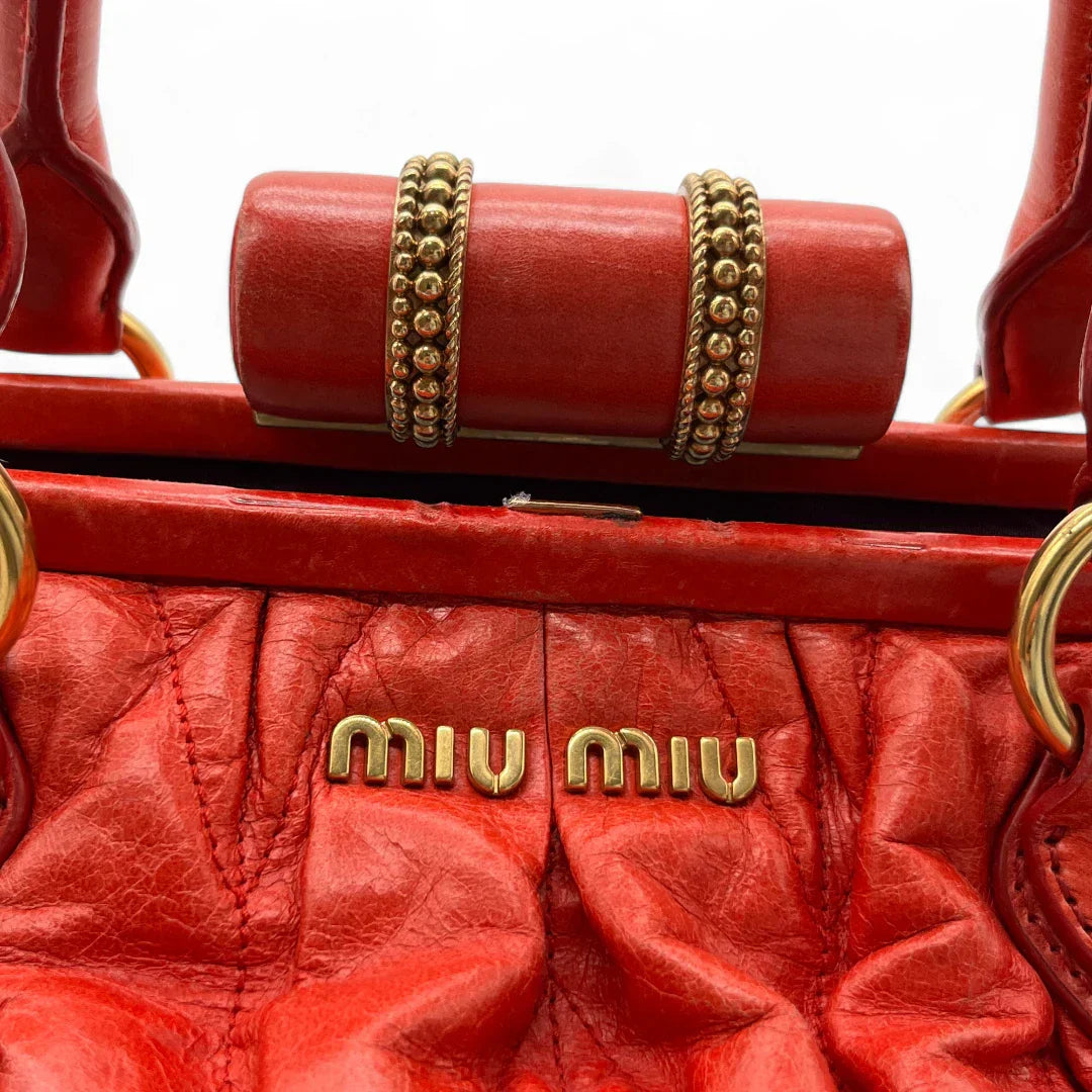 Miu Miu handbag made of leather matelasse dark red